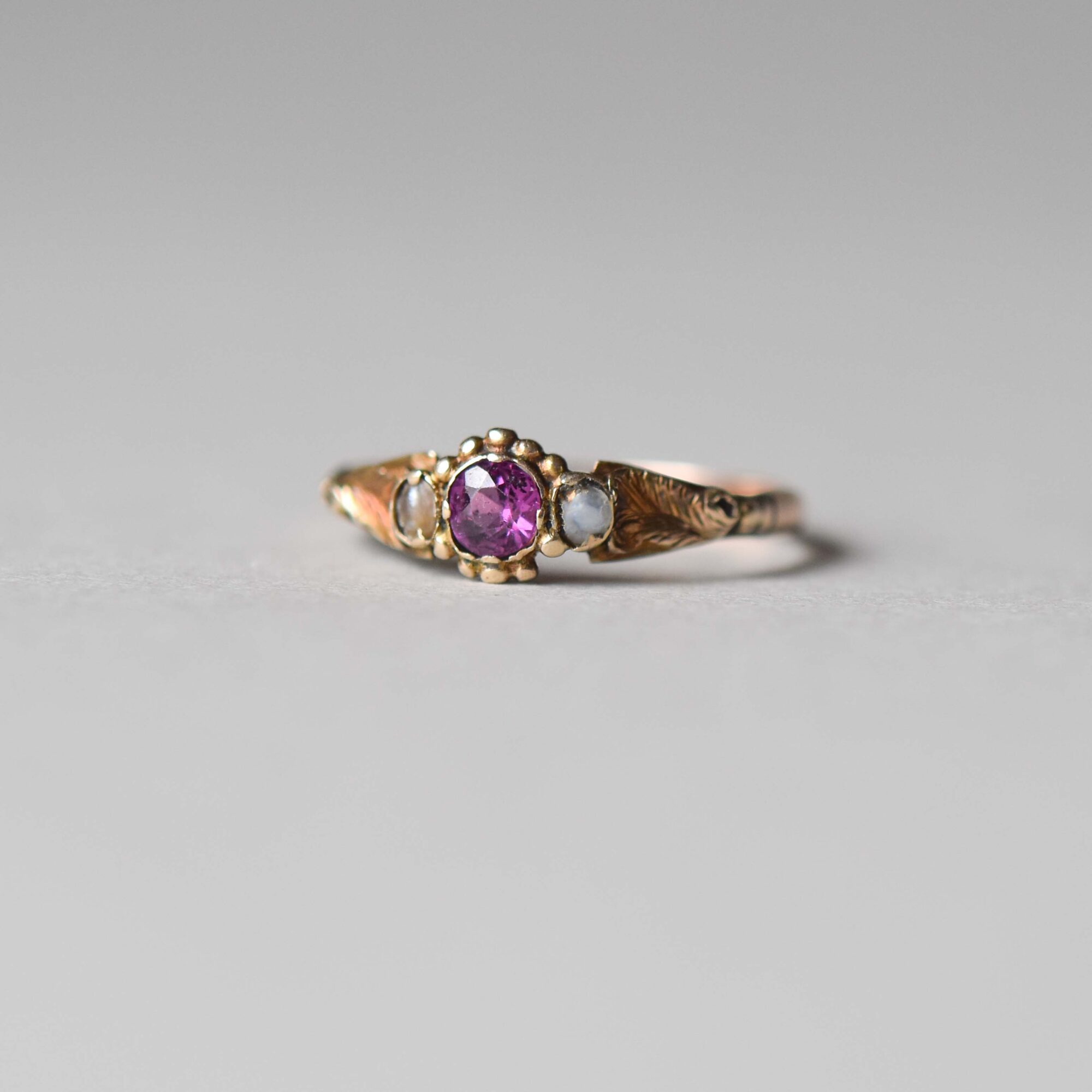 Antique Victorian 9ct gold garnet and pearl dainty floral ring, c.1880s