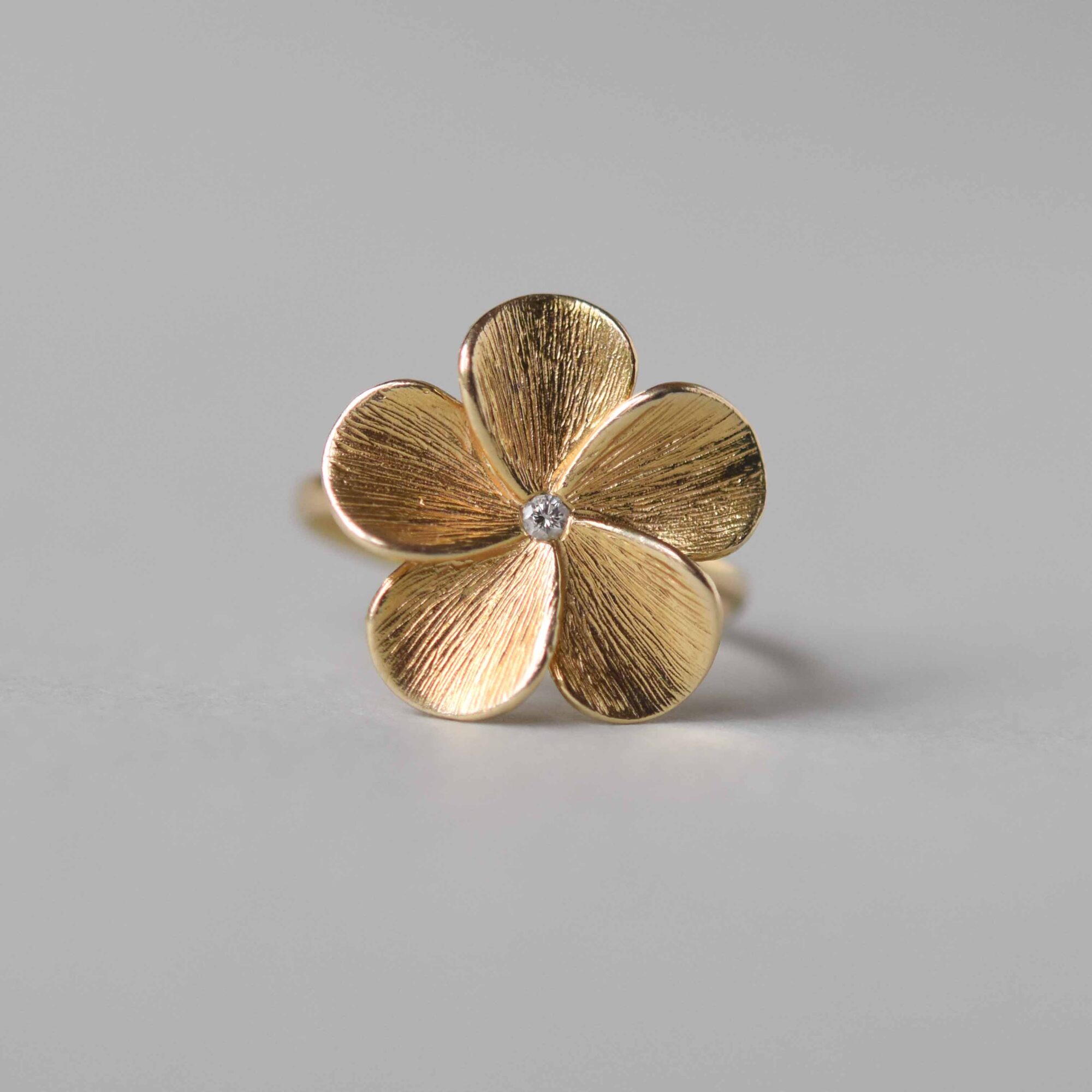Contemporary 9ct gold diamond flower ring