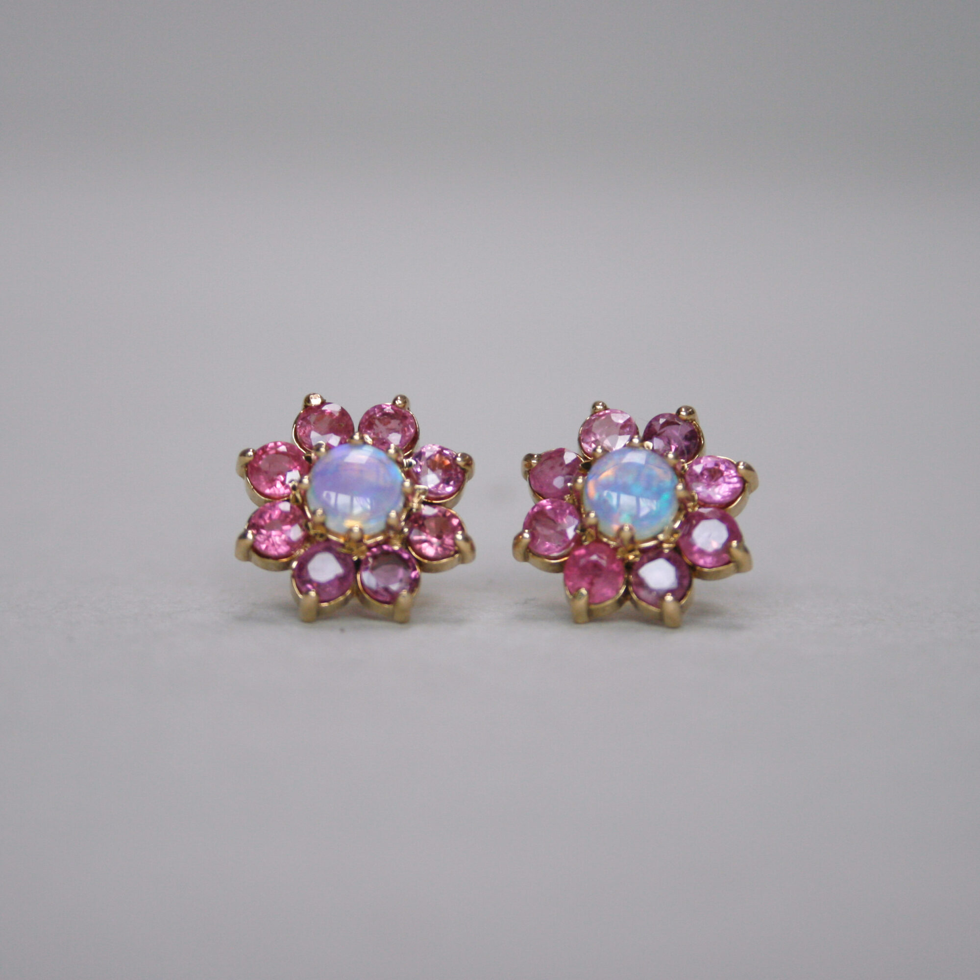 Contemporary pair of 9ct gold ruby and opal cluster earrings