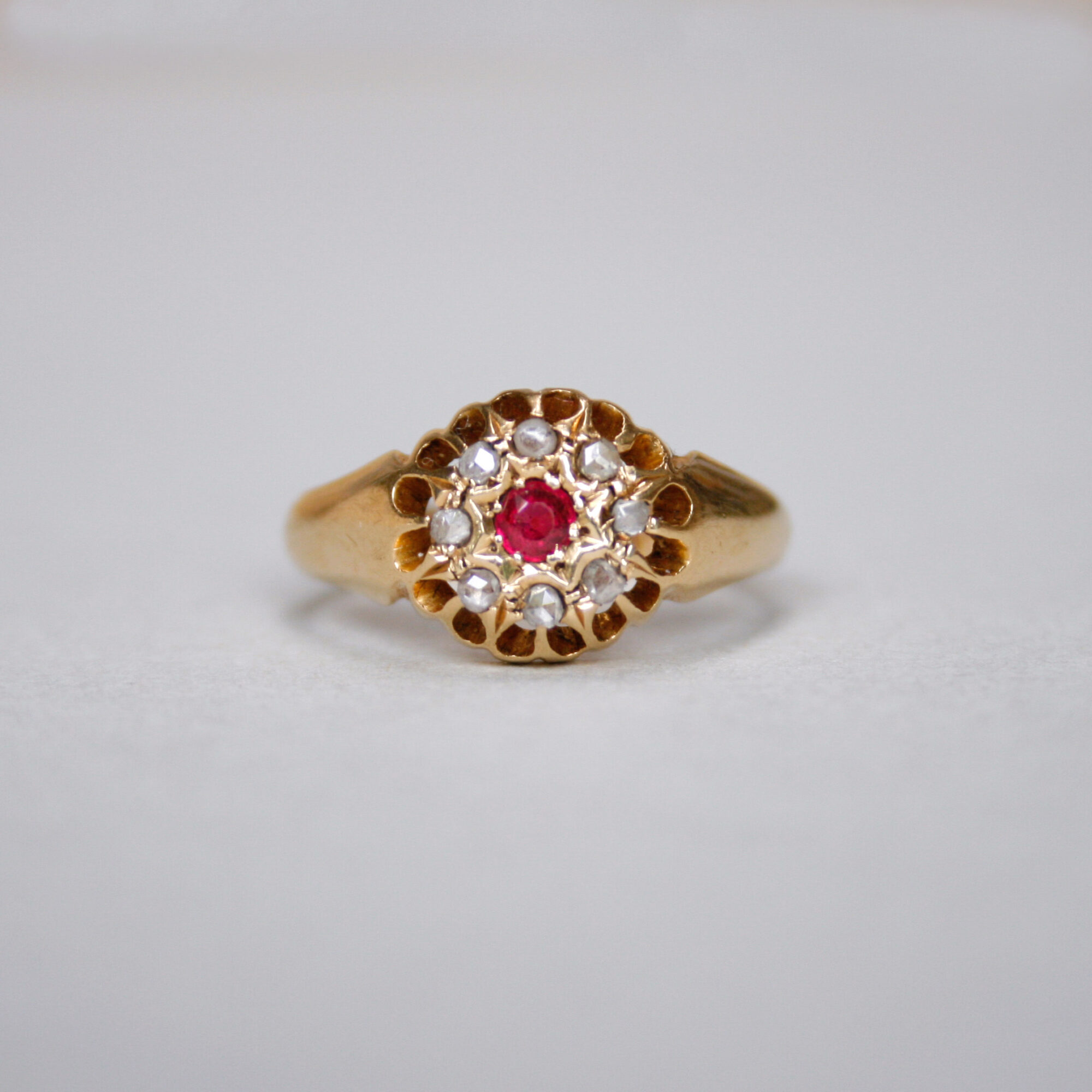 Antique 18ct gold ruby and rose cut diamond cluster ring, 1918
