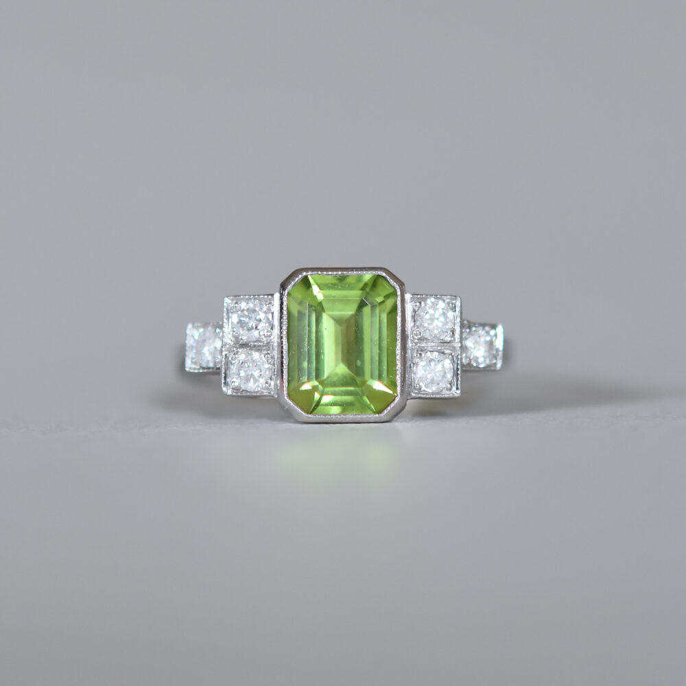 Contemporary Art Deco design peridot and diamond platinum ring