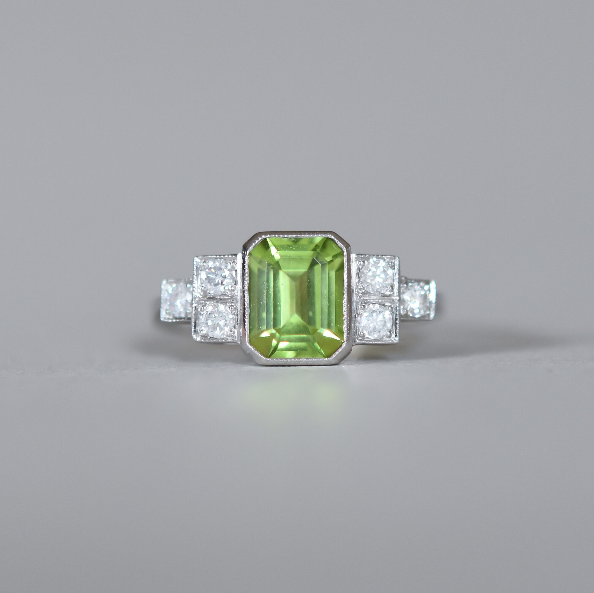 Contemporary Art Deco design peridot and diamond platinum ring