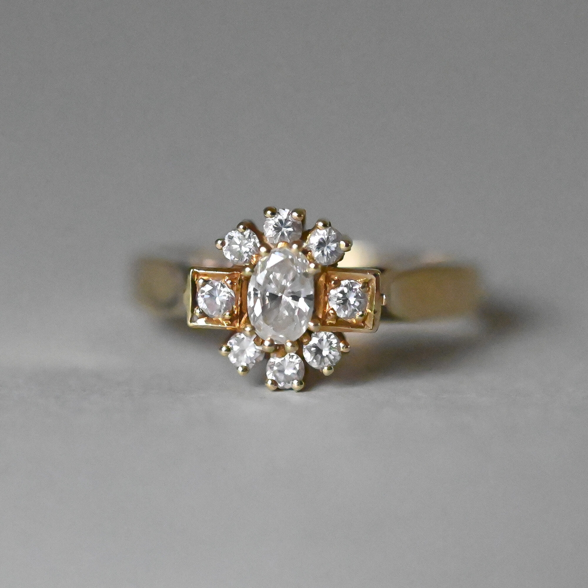 Bespoke 18ct gold oval diamond starburst cluster ring