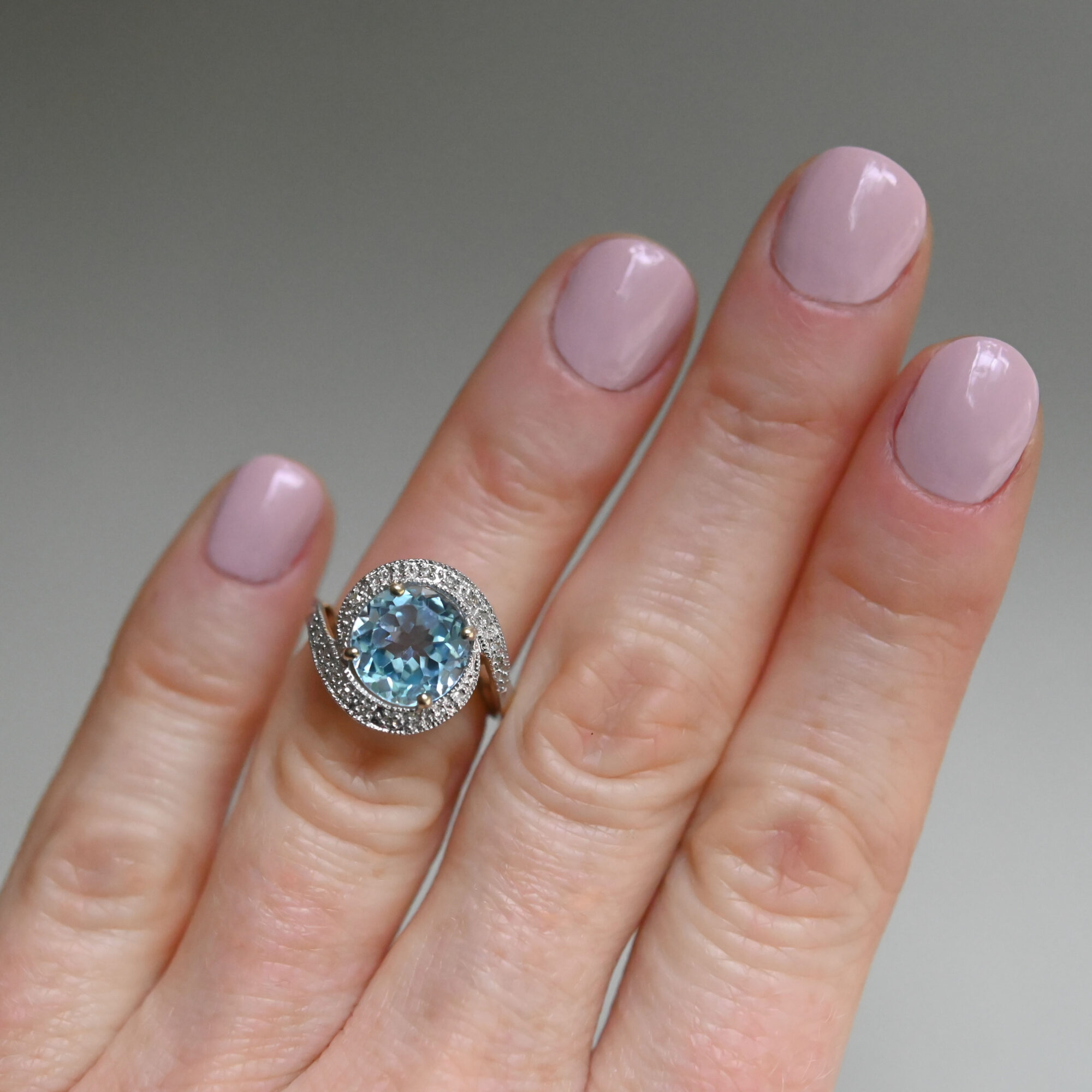 Contemporary 9ct gold blue topaz and mini diamond swirl ring - Image 3