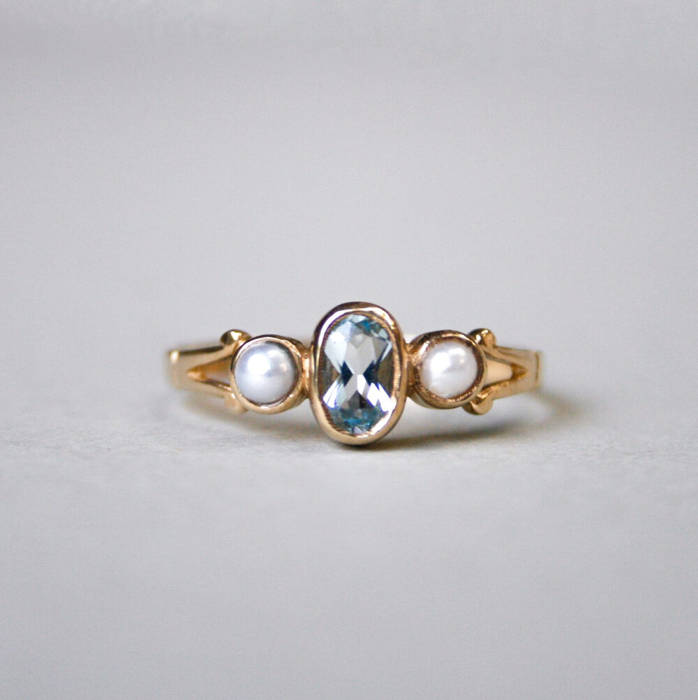 Cutie 9ct gold aquamarine and pearl three stone ring
