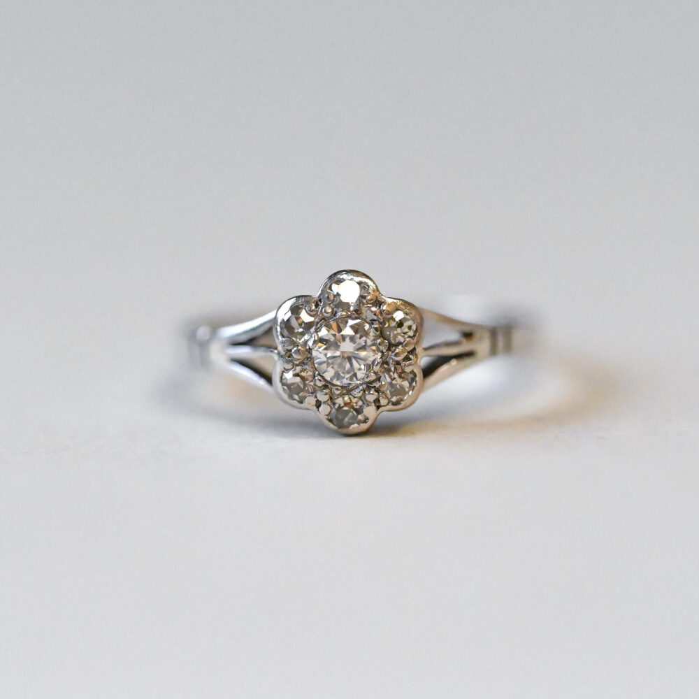 Edwardian 18ct gold and platinum diamond daisy cluster ring