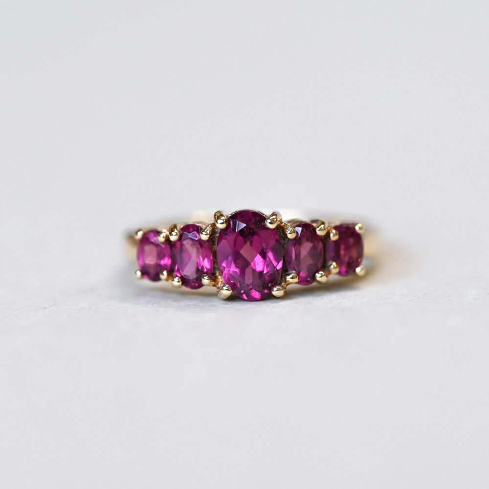 Classic 9ct gold purplish garnet five stone ring